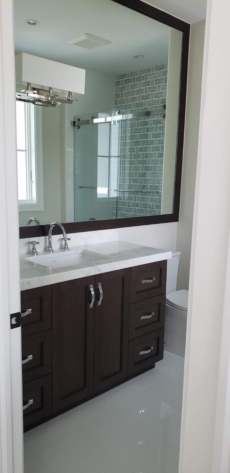 A Bathroom with Cabinet and Sink — Naples, FL — Rain Forest Marble Inc.