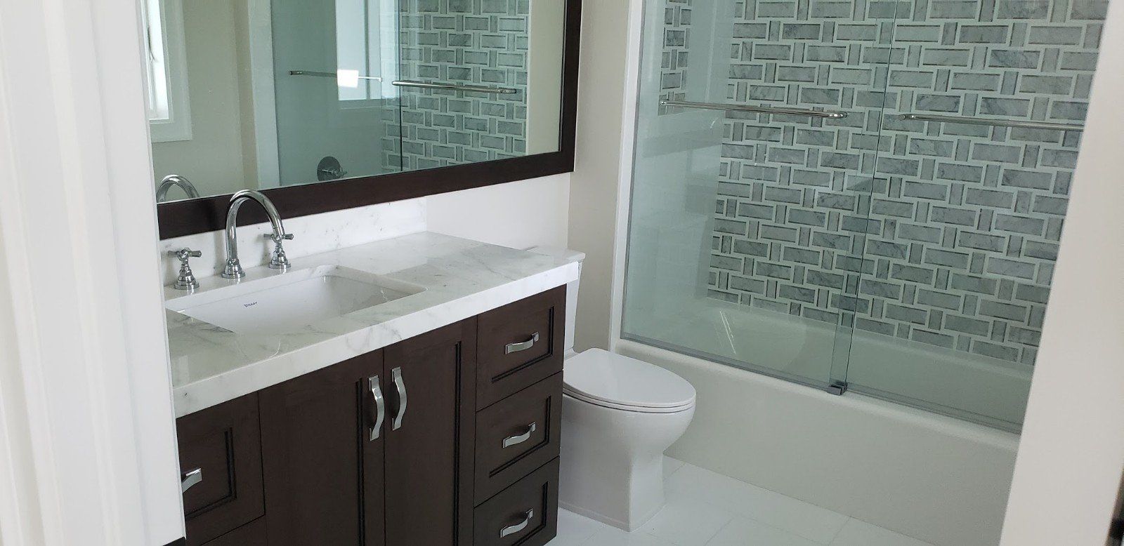 Bathroom with Brown Cabinet and Brick Design Wall — Naples, FL — Rain Forest Marble Inc.