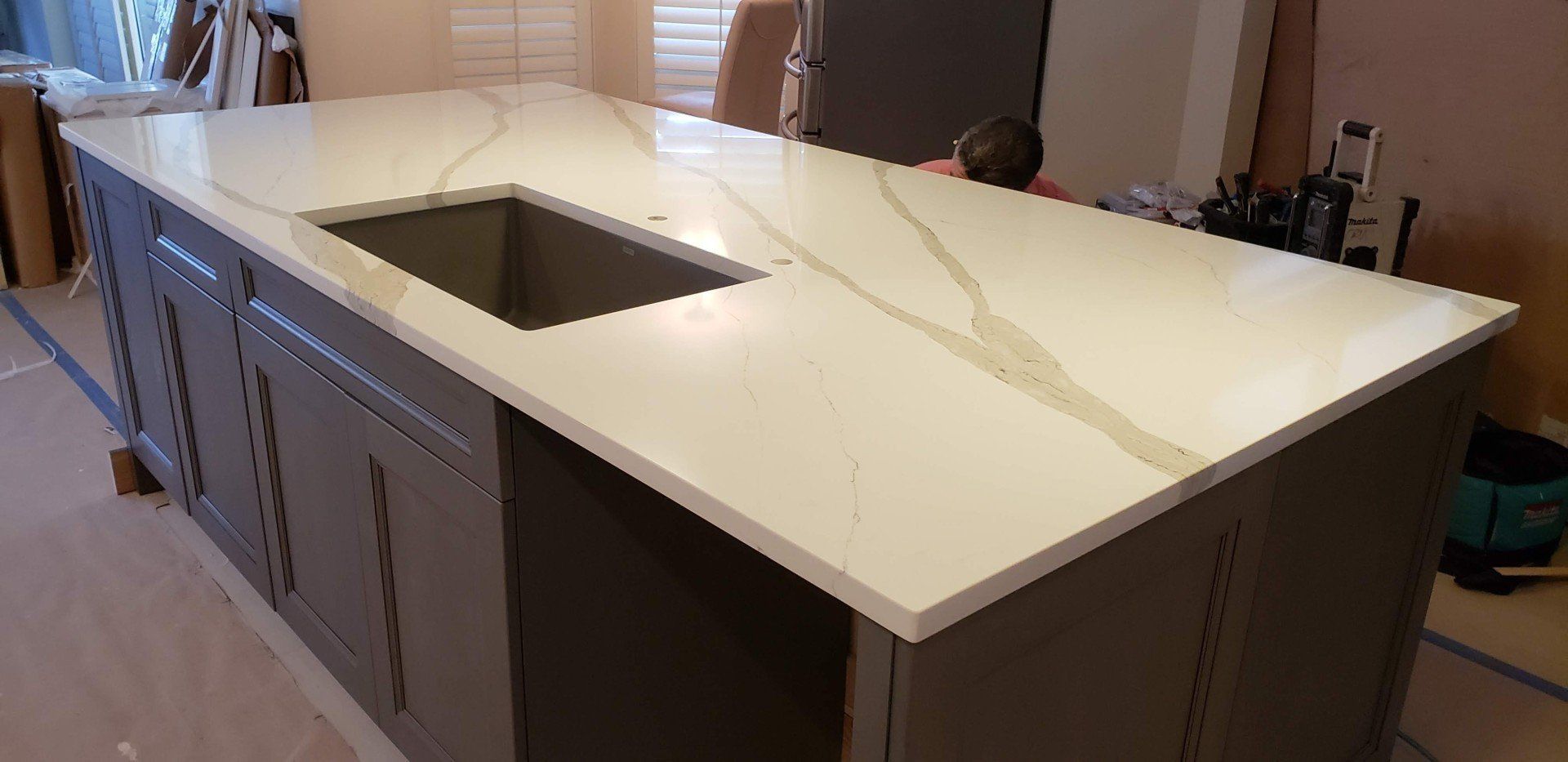 Man Painting Countertop Cabinet — St Naples, Florida — Rain Forest Marble Inc.
