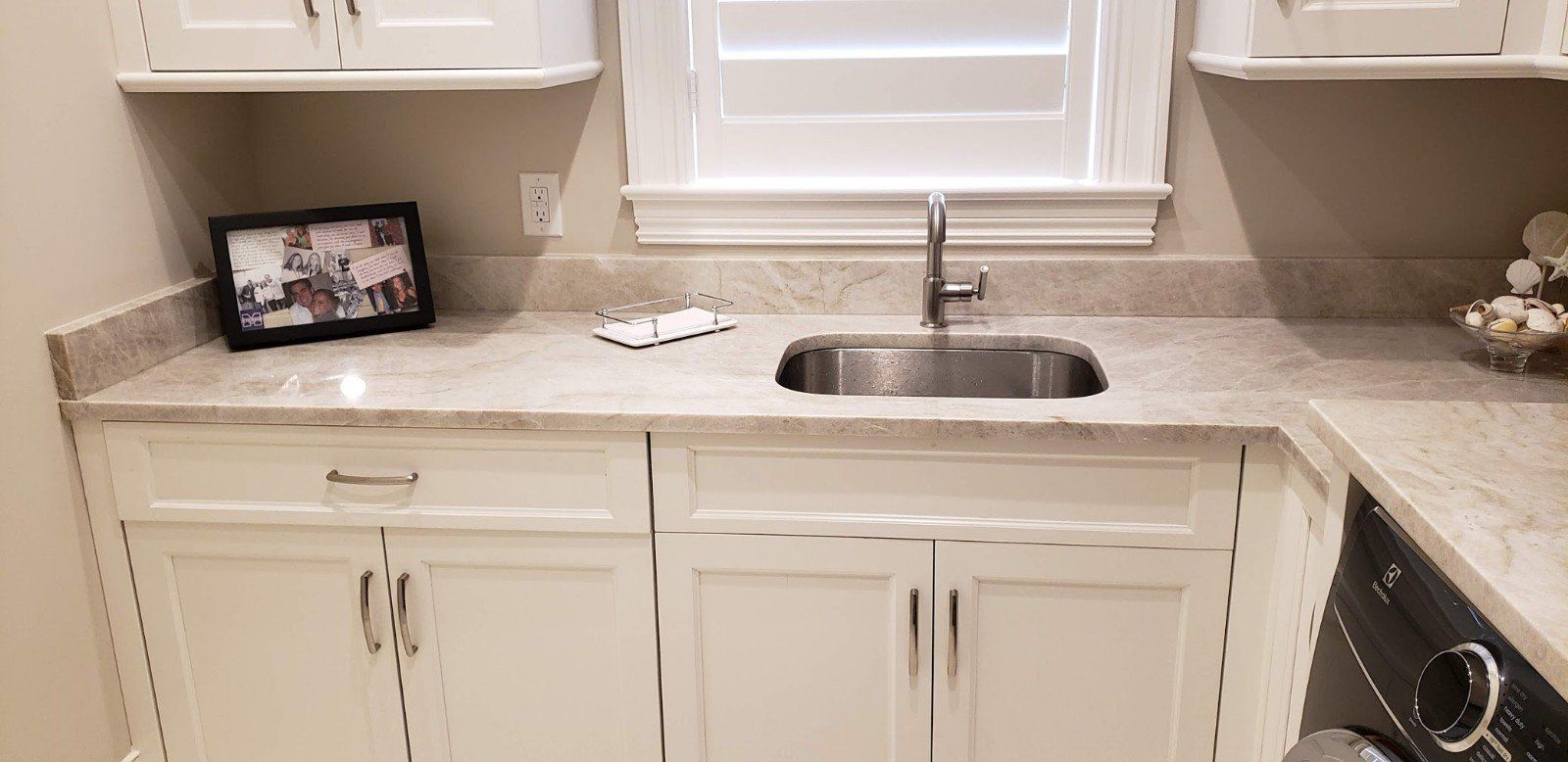 A Marble Table Kitchen With A Picture Frame — Naples, FL — Rain Forest Marble Inc.