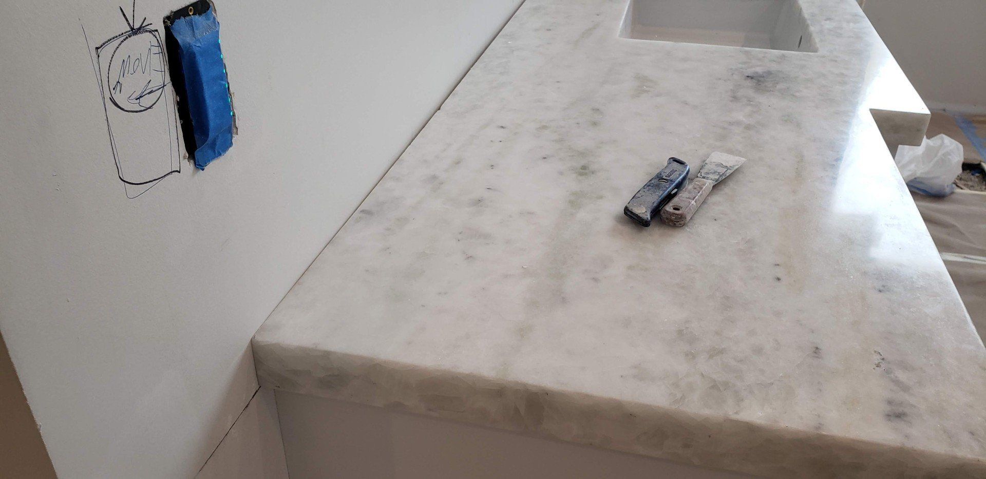Chisels On Top Of Newly Installed Countertop — Naples, FL — Rain Forest Marble Inc.