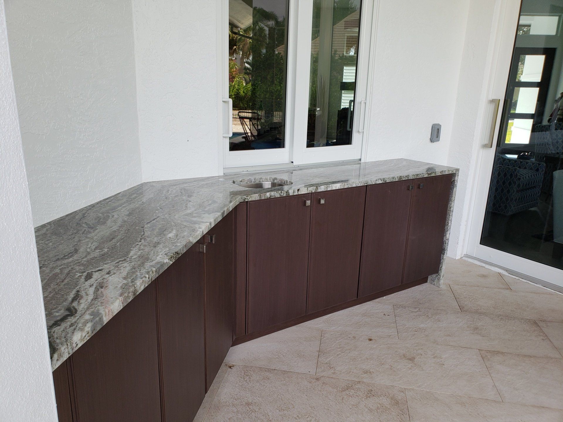 Countertop With Brown Cabinet — St Naples, Florida — Rain Forest Marble Inc.