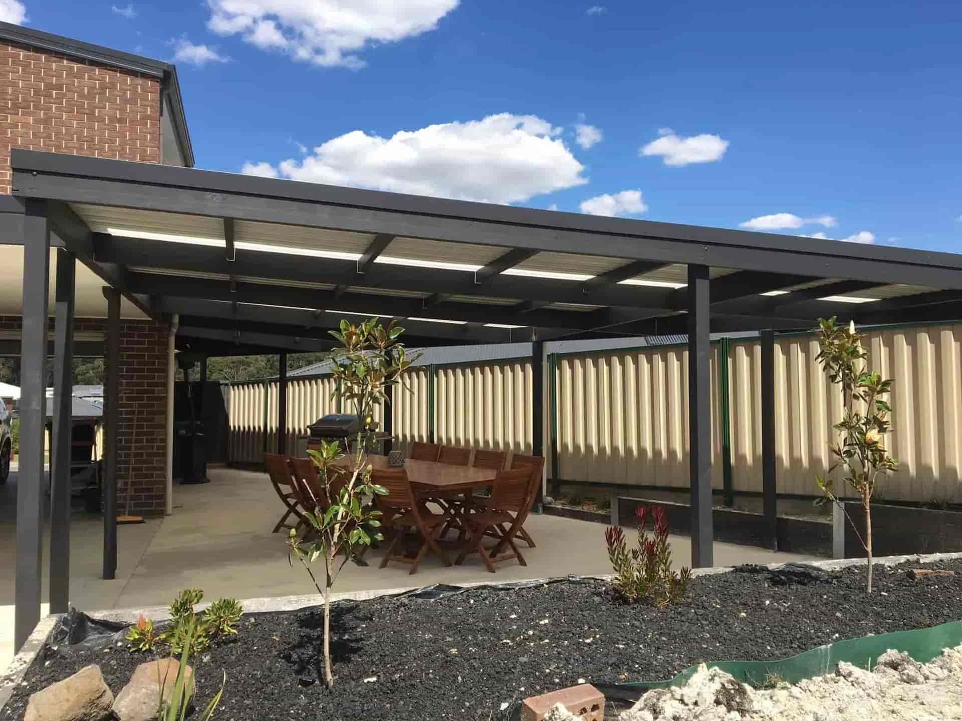 Patio with a Table and Chairs under a Pergola — Home Construction in Daylesford, VIC