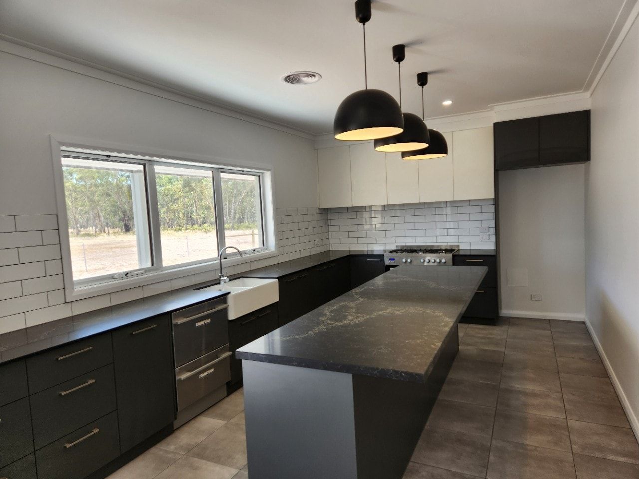 A Kitchen Sink With Two Sinks and a Faucet — Evoke Building Group In Ballarat Central, VIC