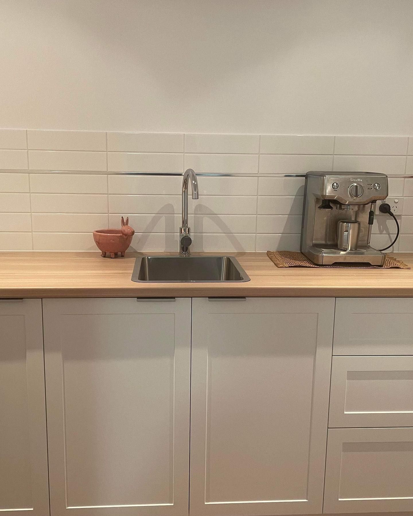 A Kitchen Counter With a Sink and a Coffee Maker — Evoke Building Group In Ballarat Central, VIC
