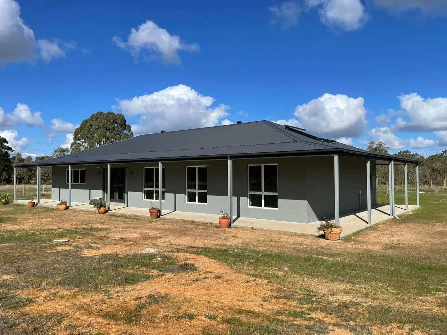 Grey House with a Black Roof and a Porch  — Home Construction in Bendigo, VIC