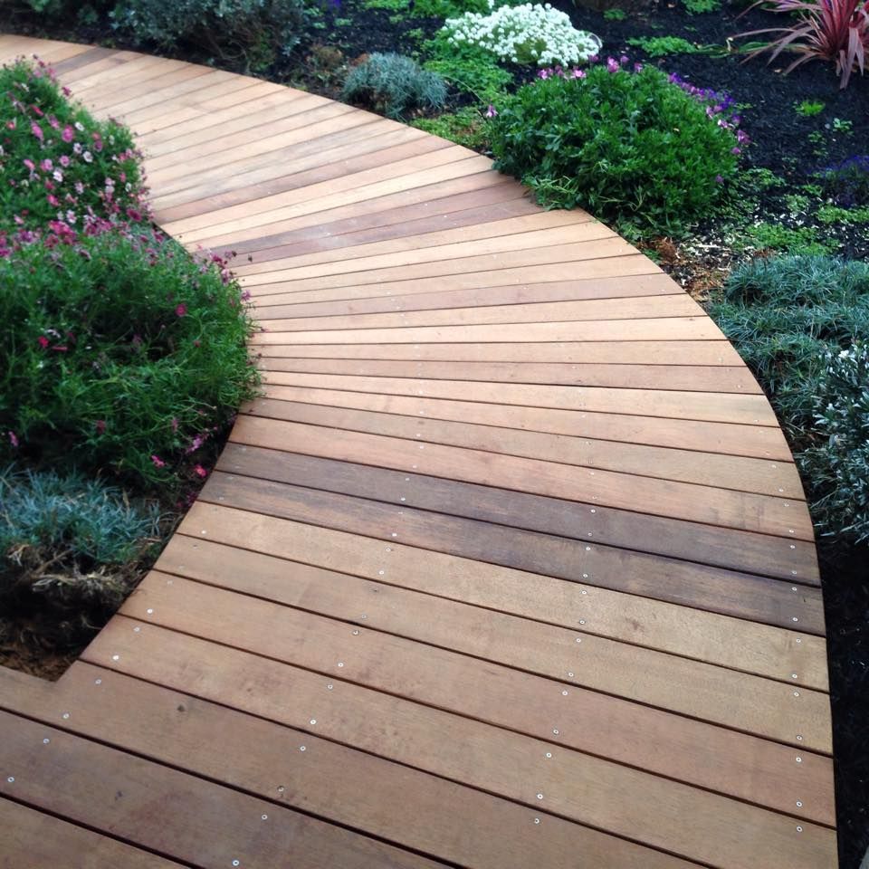 Wooden Walkway Surrounded by Flowers and Bushes — Home Construction in Ararat, VIC