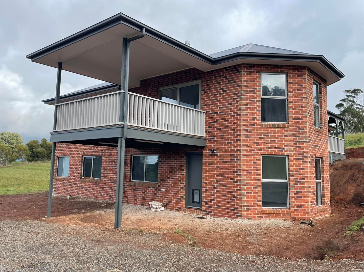 An Empty Room With a Sliding Glass Door and Two Windows — Evoke Building Group In Ballarat Central, VIC