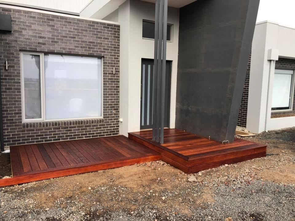 A Large Brick House With a Wooden Deck and Stairs — Evoke Building Group In Ballarat Central, VIC
