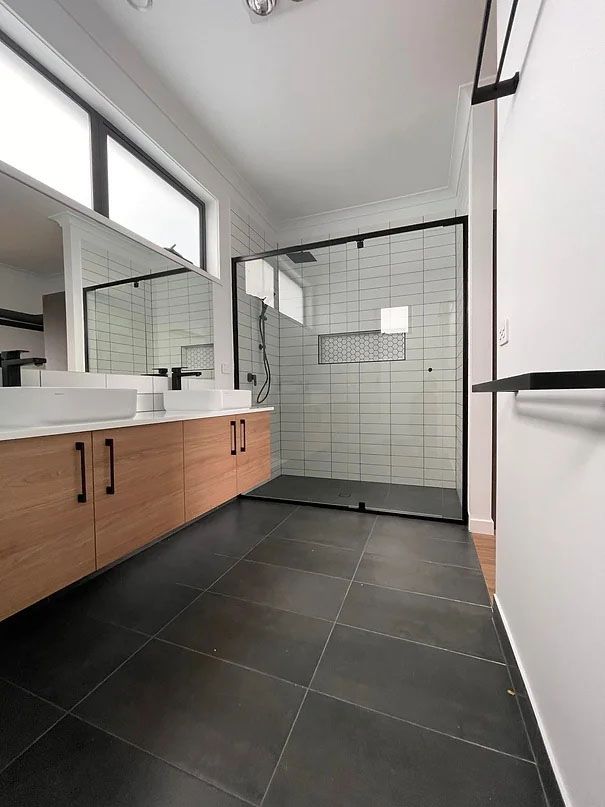 A Bathroom With Two Sinks and a Walk in Shower — Evoke Building Group In Ballarat Central, VIC