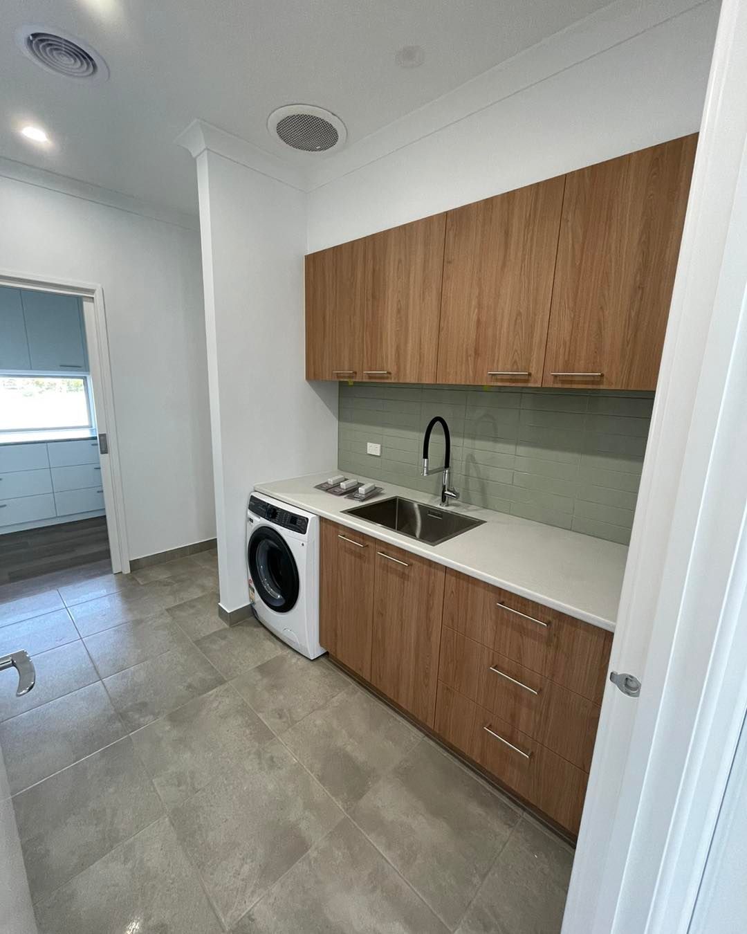 A Kitchen With a Sink and a Faucet on the Counter — Evoke Building Group In Ballarat Central, VIC