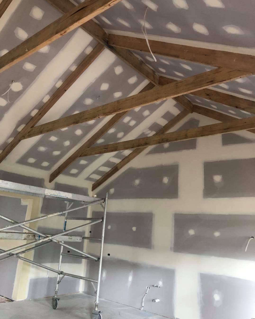 A Room That is Being Remodeled With a Scaffolding in the Middle of It — Evoke Building Group In Ballarat Central, VIC