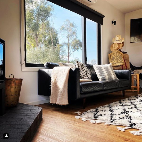 A Wooden Staircase With a Wooden Railing in a House — Evoke Building Group In Ballarat Central, VIC