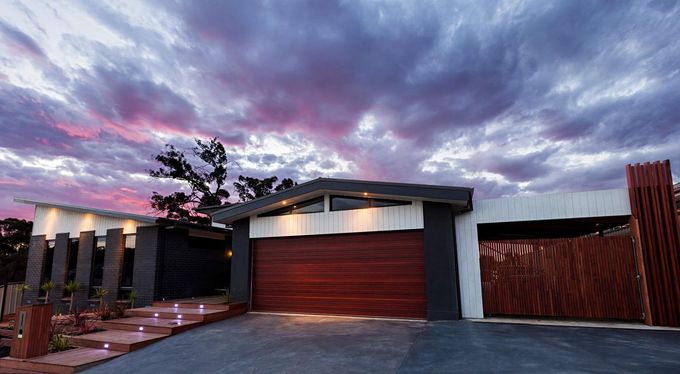 A Modern House With a Purple Sky in the Background — Evoke Building Group In Ballarat Central, VIC