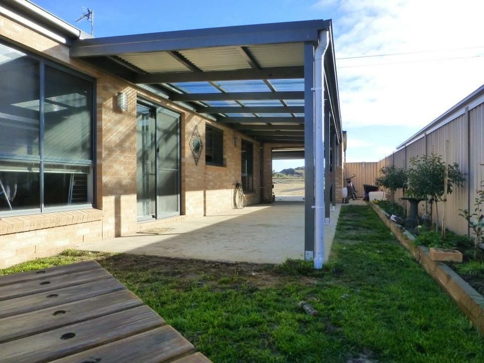 A Brick House With a Covered Porch and a Clear Roof — Evoke Building Group In Ballarat Central, VIC