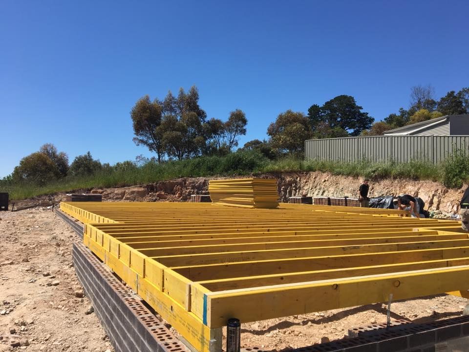 A Wooden Floor is Being Built on a Construction Site — Evoke Building Group In Ballarat Central, VIC