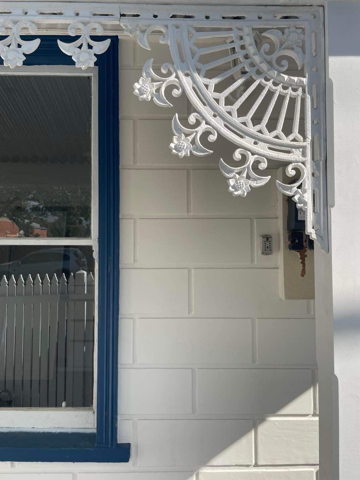 A White House With a Blue Trim and a White Porch — Evoke Building Group In Ballarat Central, VIC