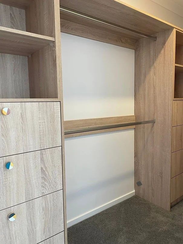 A Kitchen Sink With a Faucet and a Television in the Background — Evoke Building Group In Ballarat Central, VIC