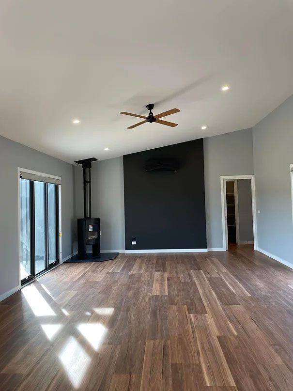 Living Room With Ceiling Fan and Tile Floors — Evoke Building Group In Ballarat Central, VIC