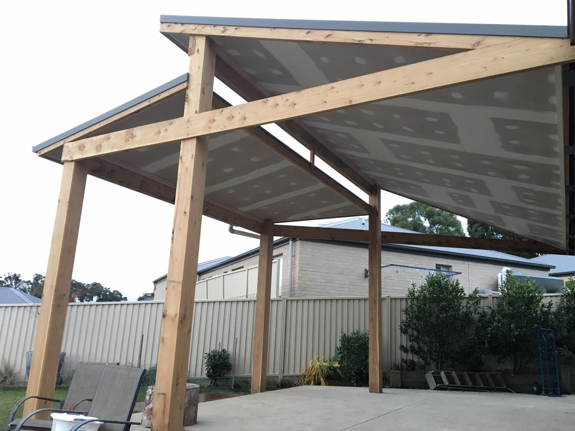 A Wooden Building With a Roof and a Covered Area in the Backyard — Evoke Building Group In Ballarat Central, VIC
