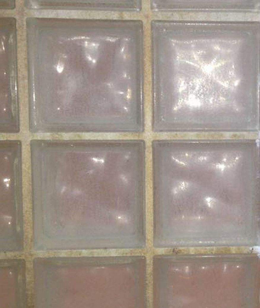 A close up of a wall made of glass blocks.