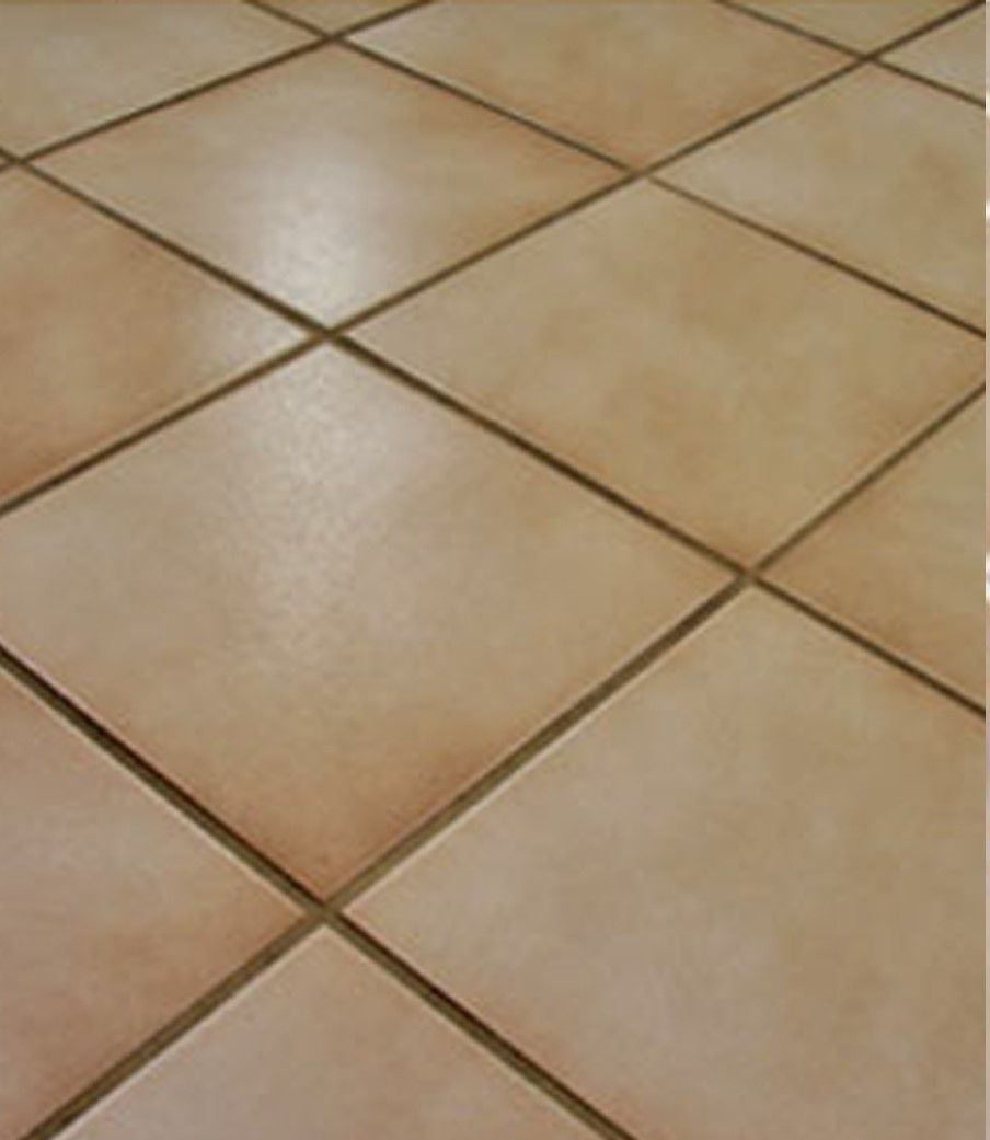 A close up of a tiled floor with a diagonal pattern