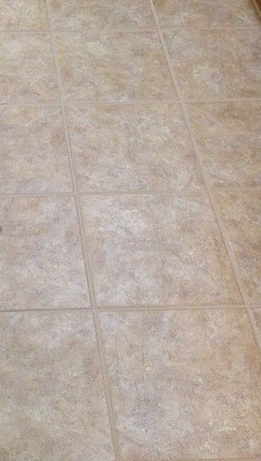 A close up of a tiled floor in a room.