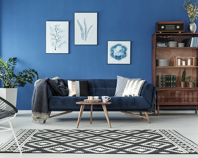 Living Room with Blue Wall — Okemos, MI — Tony Grant’s Painting Company