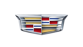 Cadillac logo: chrome shield with gold, red, and blue accents.