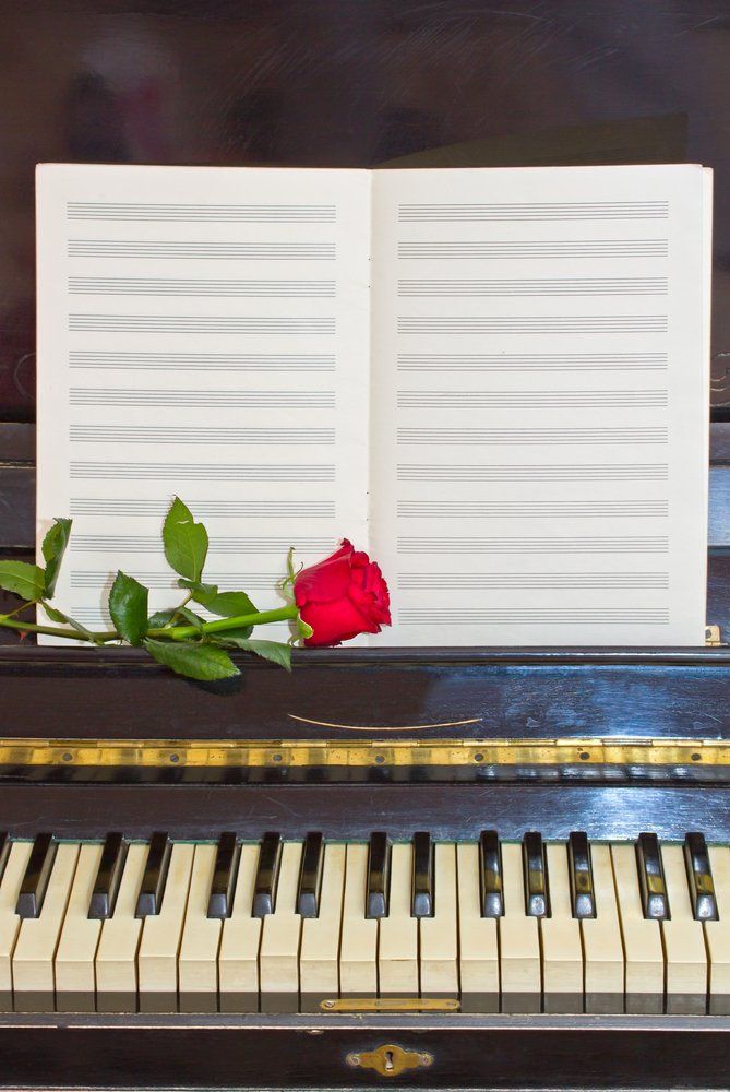 Vintage Piano With Red Rose — Academic & Music Tutors in Newcastle NSW