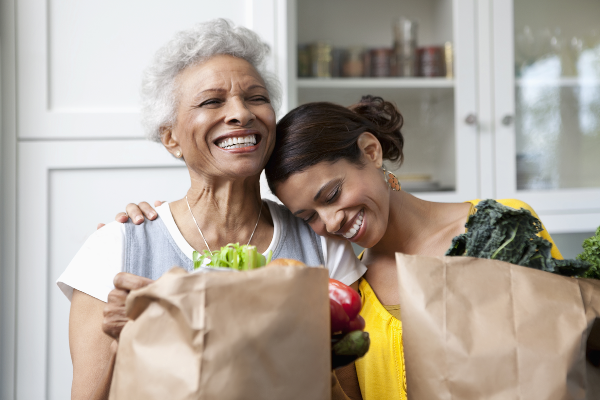Occupational Therapy Mother and Daughter with Grocery Bags Smiling
