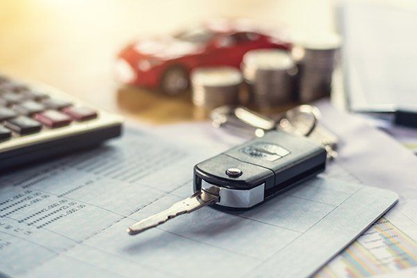 Car Key with Money and Calculator on Table — Chicago, IL — Illinois Insurance Center Inc