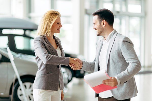 Customer Buying a Car at Dealership — Chicago, IL — Illinois Insurance Center Inc