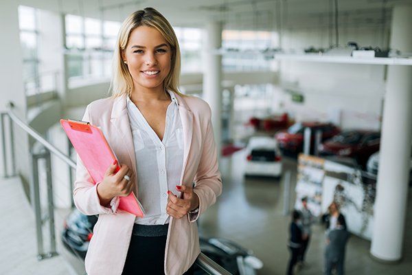 Professional Salesperson Working in Car Dealership — Chicago, IL — Illinois Insurance Center Inc