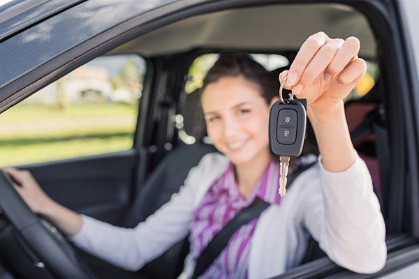 Woman Holding Her New Car Keys — Chicago, IL — Illinois Insurance Center Inc