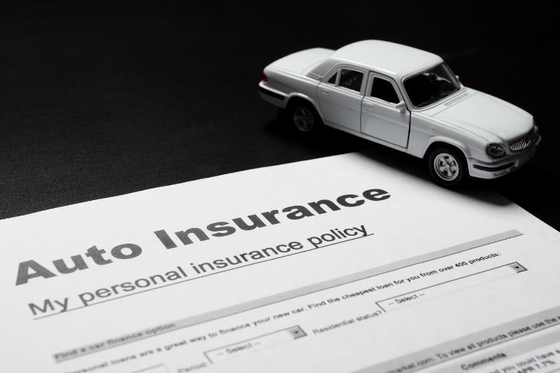 Auto Insurance Form with Miniature Car — Chicago, IL — Illinois Insurance Center Inc