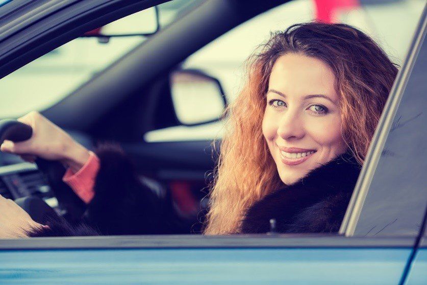 Smiling Woman in The Car — Hillside, IL — Illinois Insurance Center Inc
