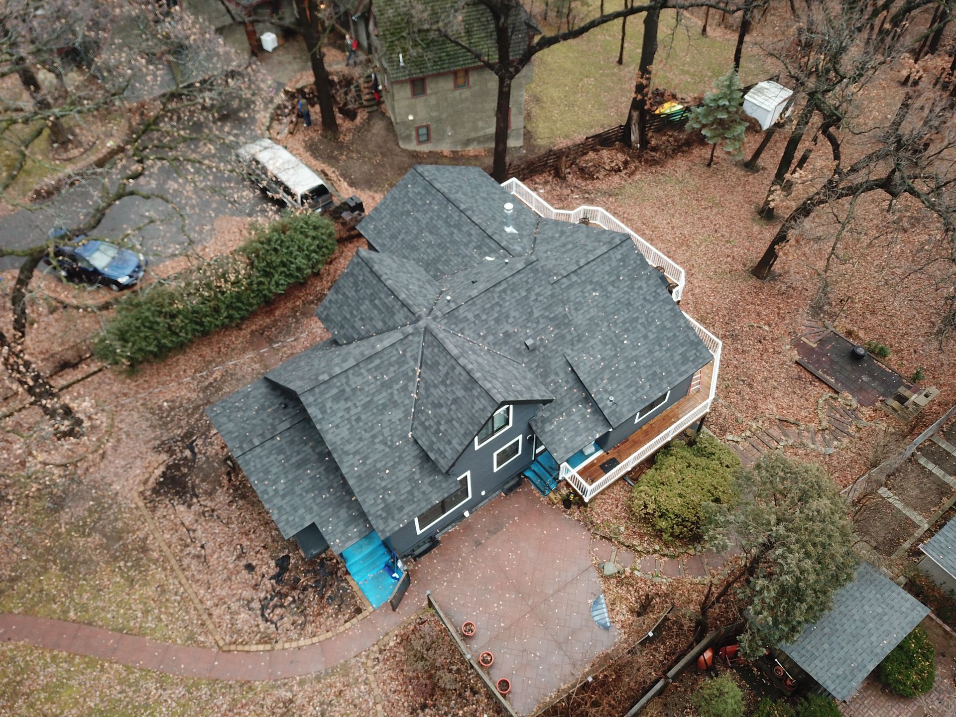 An aerial view of a house with a roof that is being installed.