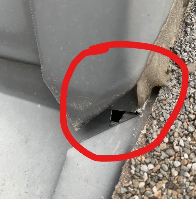 A red circle is drawn around a gray object