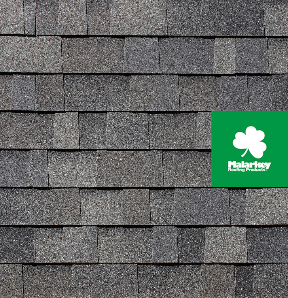 A close up of a roof with a clover on it