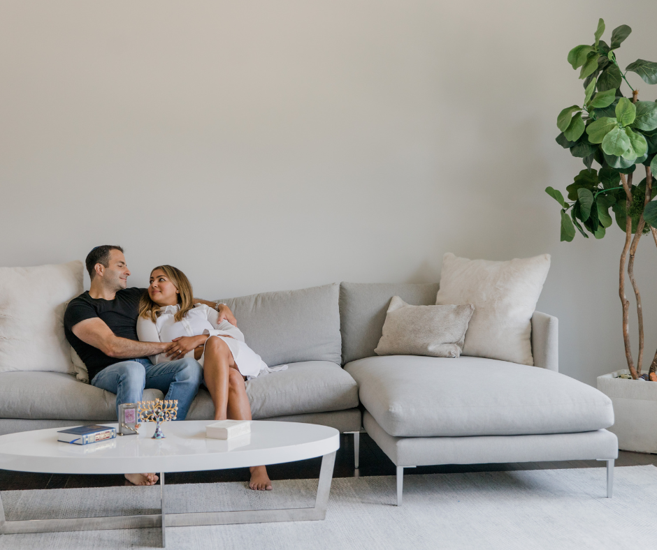 Minnesota happy homeowner couple sitting in their living room together