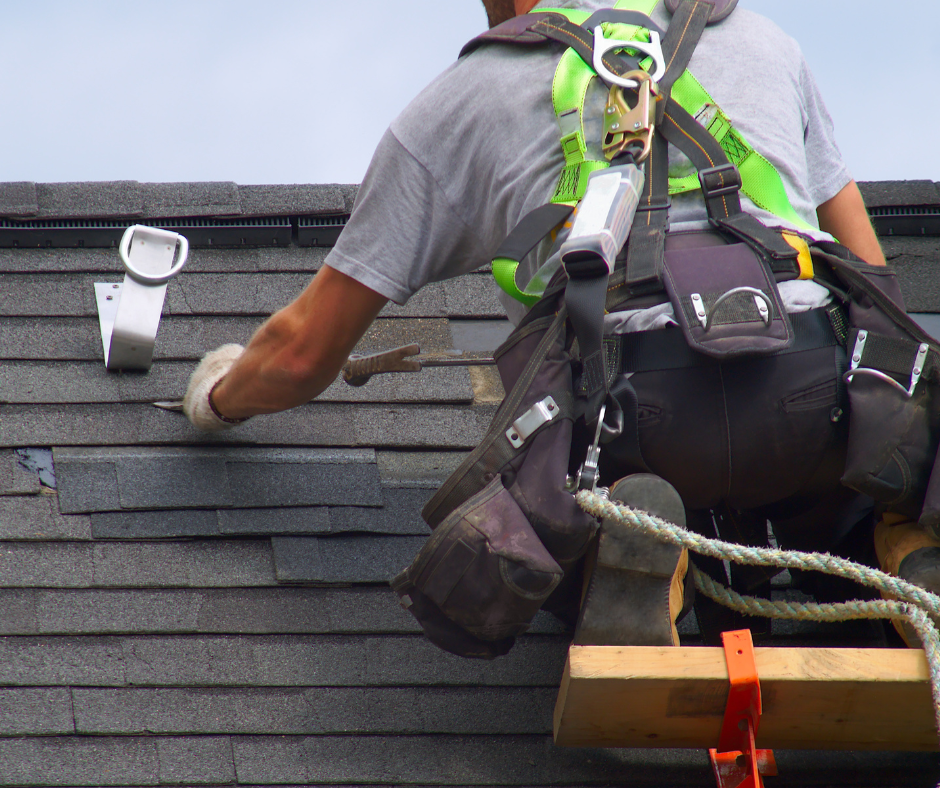 A Minnesota roofer working on repairing a roof in the Twin Cities