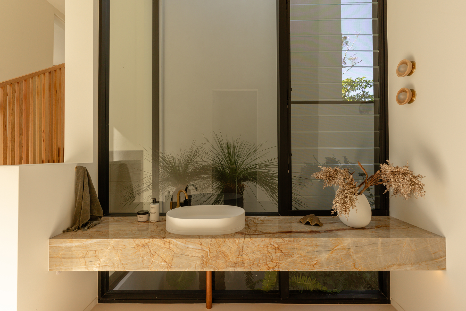 A Modern Bathroom With a Marble Countertop and a Large Window — Architectural Glass Solutions QLD in Cooroy, QLD