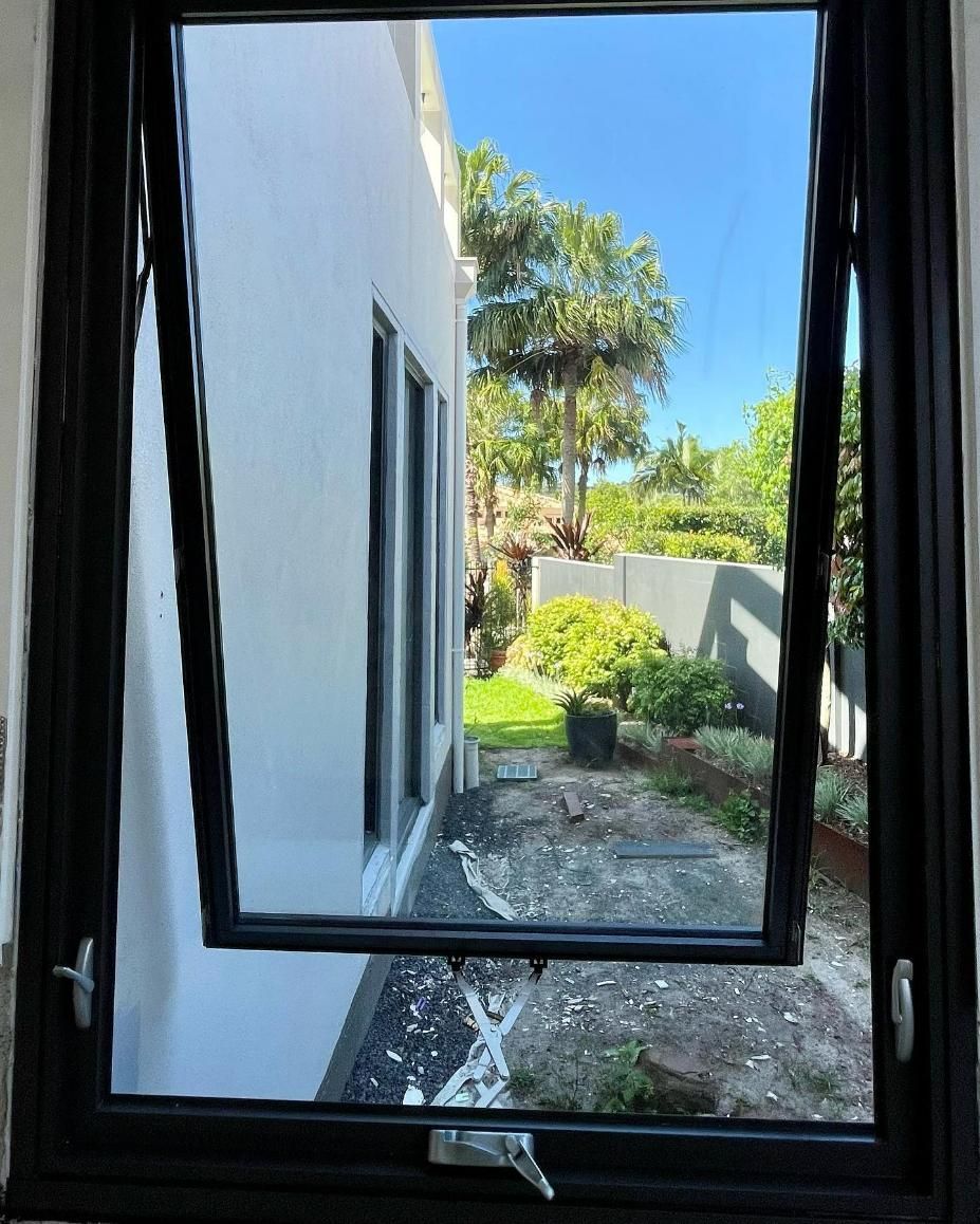 The Window Is Open and Looking out To a Backyard — Architectural Glass Solutions QLD in Cooroy, QLD