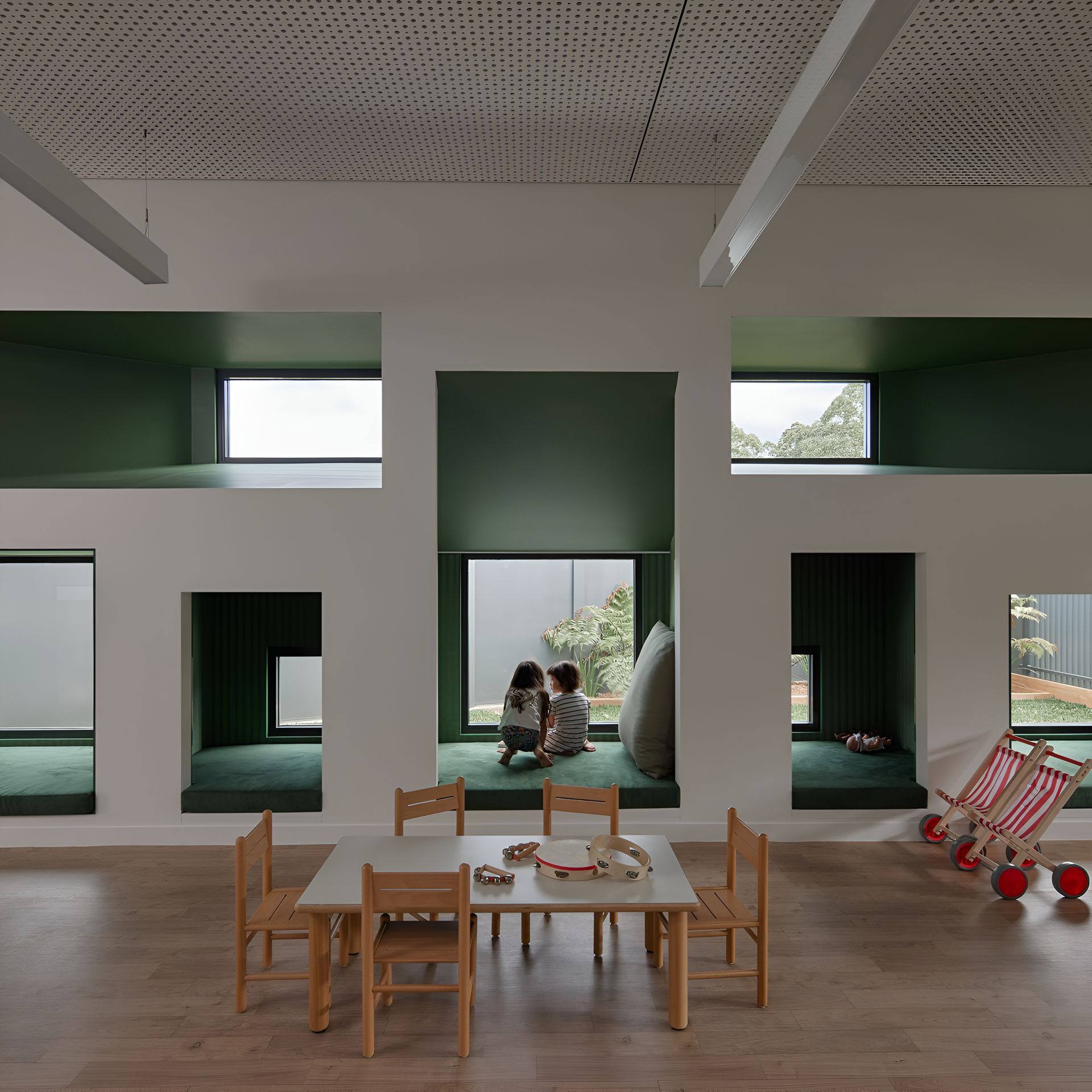 Children Play in a Bright, Modern Classroom With Green Alcoves — Architectural Glass Solutions QLD in Cooroy, QLD