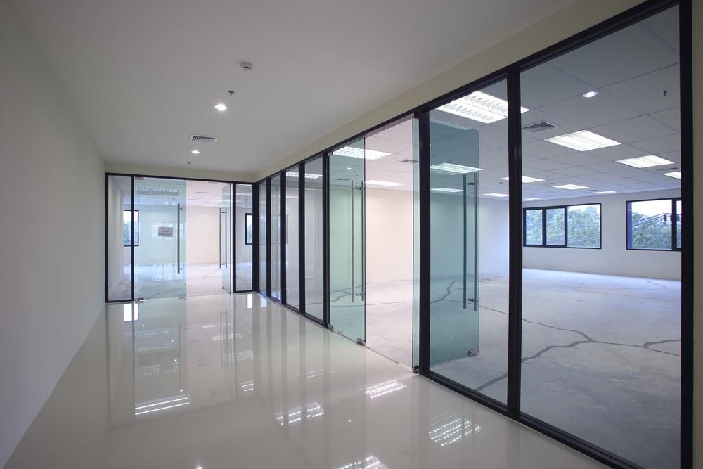 A Modern Office Hallway With Glass-walled Rooms — Architectural Glass Solutions QLD in Cooroy, QLD