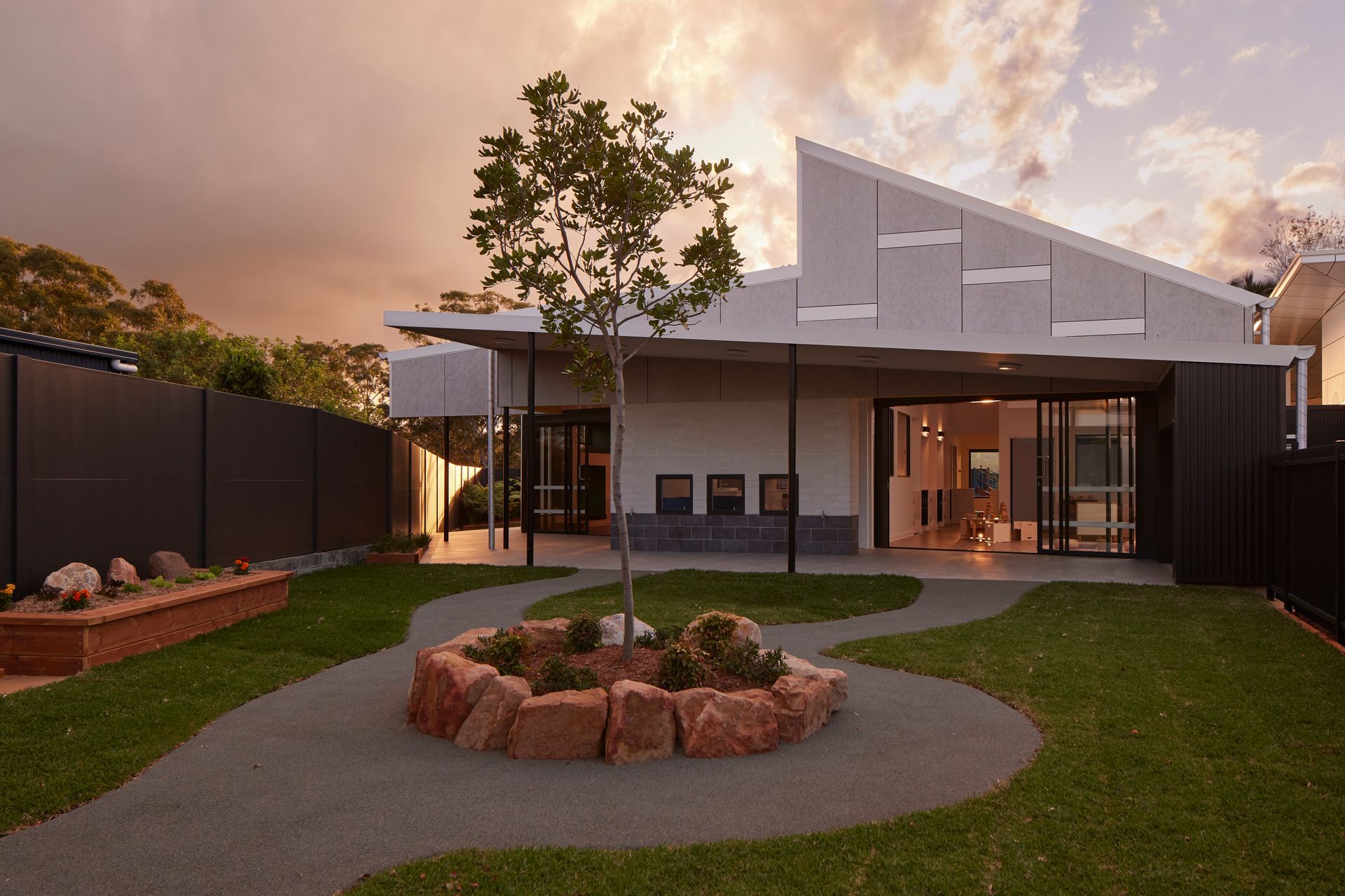 Outside a building of a school with the sun setting  — Architectural Glass Solutions QLD in Cooroy, QLD