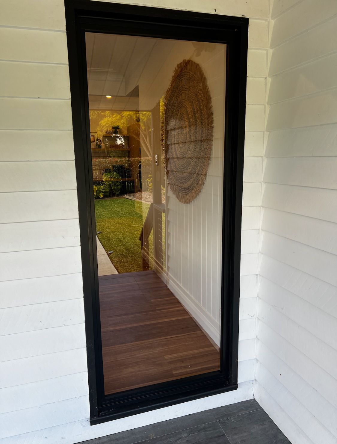 Black-framed Glass Door With a Wooden Interior — Architectural Glass Solutions QLD in Cooroy, QLD