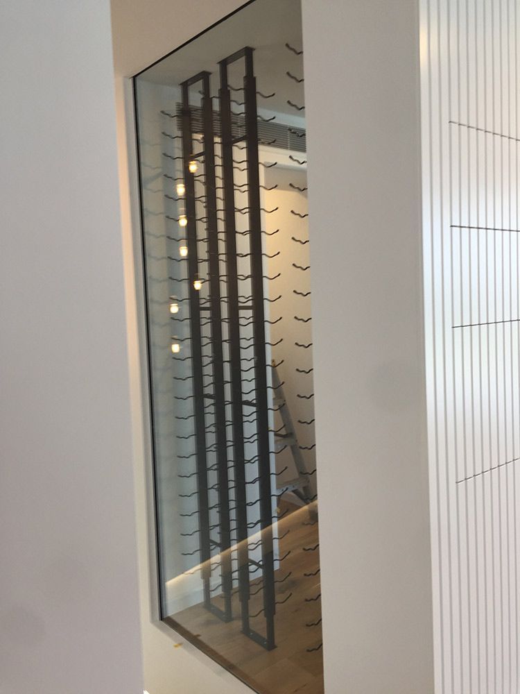Built-in Wine Rack With Glass Panels. Dark Metal Rods — Architectural Glass Solutions QLD in Cooroy, QLD