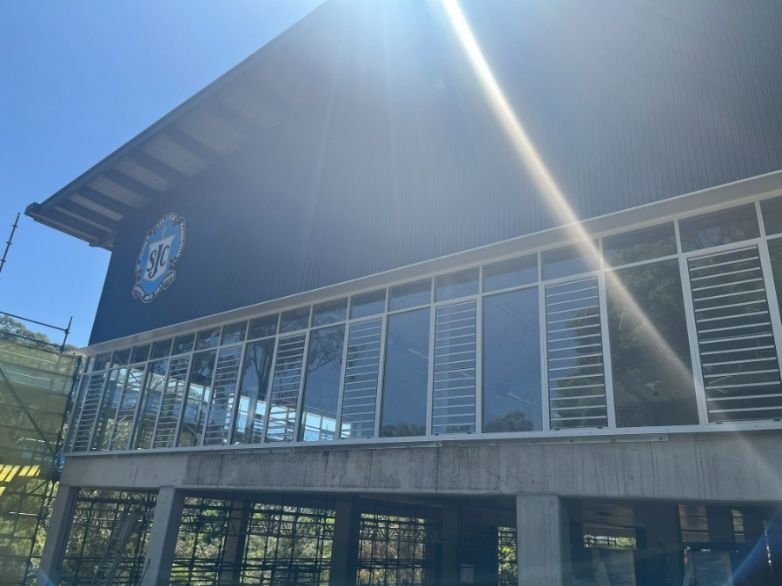 The Sun is Shining Through the Windows of a Building — Architectural Glass Solutions QLD in Cooroy, QLD